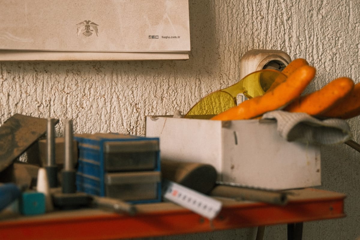 Organised workshop shelf with tools and storage boxes